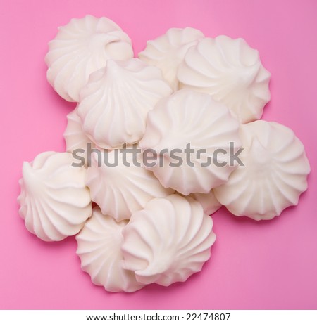 group of marshmallow covered with white chocolate on pink background