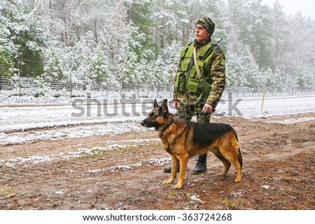 Odessa, Ukraine - December 16, 2015: Border dog with a soldier