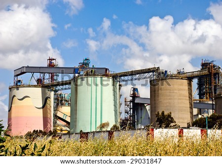 Big colored tanks of a modern cement plant