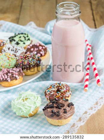 Fresh baked homemade mini donuts with strawberry milk drink