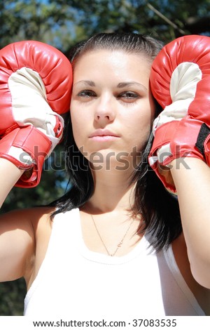 young sexual brunette in red boxing glove