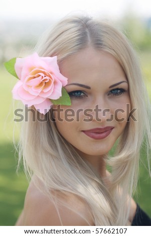 portrait pretty blonde with flower in hair