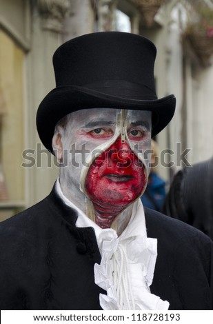 WHITBY, UK - NOV 4: A man in top hat and macabre face painting celebrating the famous Goff Weekend at Whitby, England on November 4, 2012.