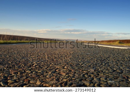 Low angle view of road with shallow depth of field and copy-space.