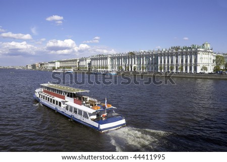 Neva River with river boat and the State Hermitage Museum or Winter Palace at Saint Petersburg, Russia.