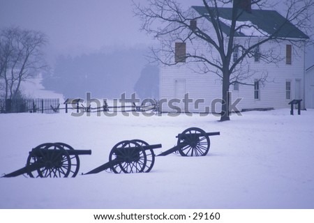 Cannon on the Civil War battlefield of Manassas (Bull Run) in the winter, with Henry House in background, near Manassas, Virginia