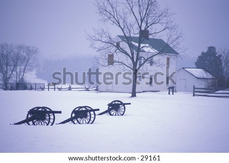 Cannon on the Civil War battlefield of Manassas (Bull Run) in the winter, with Henry House in background, near Manassas, Virginia