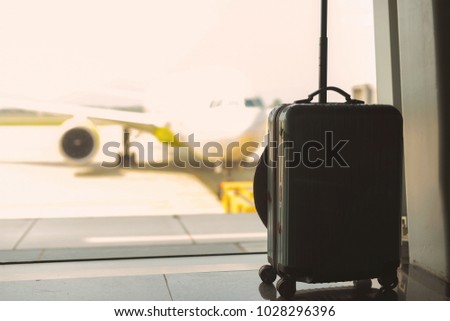 traveling luggage in airport terminal