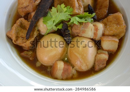 Eggs and sweet pork with fried tofu,boiled in brown sauce(Thai food called Pa lo )