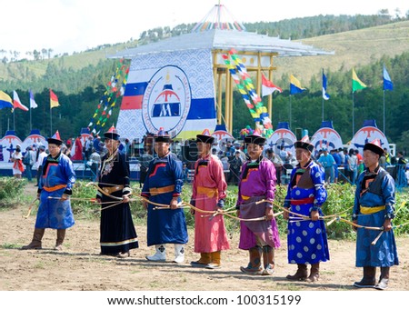 ULAN-UDE, RUSSIA - JULY 17: The 4th General Session of the World Mongolians Convention, July 17, 2010 in Ulan-Ude, Buryatia, Russia. Competitors in Mongolian archery are ready for the contest.