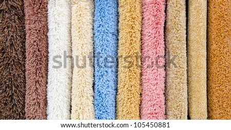 different colourful artificial shaggy carpet samples, closeup