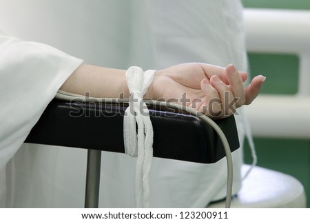 a hand of a patient during a surgical operation - closeup