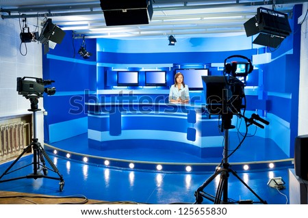 A Television Announcer At Studio During Live Broadcasting