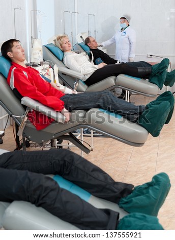 ULAN-UDE, RUSSIA - APR 6: Unidentified volunteers donate blood at a transfusion station. City Blood Service makes a promo action for donorship popularization, Apr 6, 2010, Ulan-Ude, Buryatia, Russia.