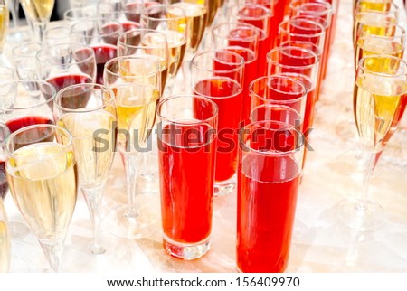 a lot of alcohol drinks on buffet table, catering