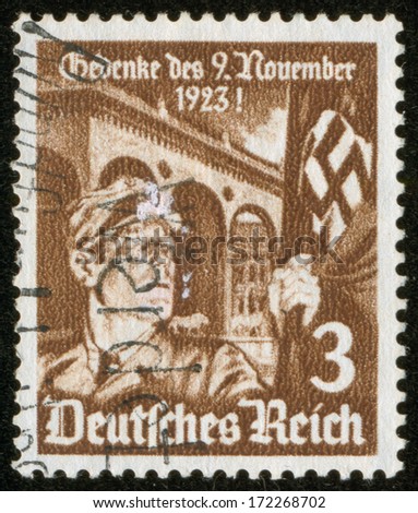GERMANY - CIRCA 1935: A stamp printed by the fascist Germany Post is entitled Do not forget November 23, 1923! It shows a soldier with a fascist banner, circa 1935