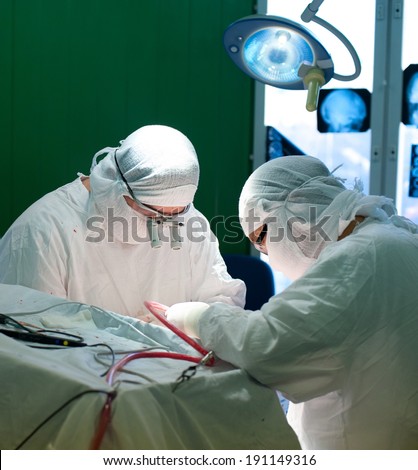 a real brain surgery, two surgeons at work