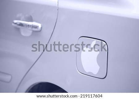 SIEM REAP, CAMBODIA - JUNE 28, 2014: The logotype Apple on a car fuel cell flap. Cambodia is a poor country and Apple is the most popular brand subject to falsification.