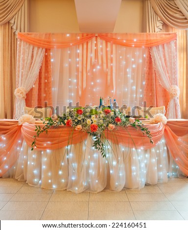 wedding restaurant table decorated in peach colour