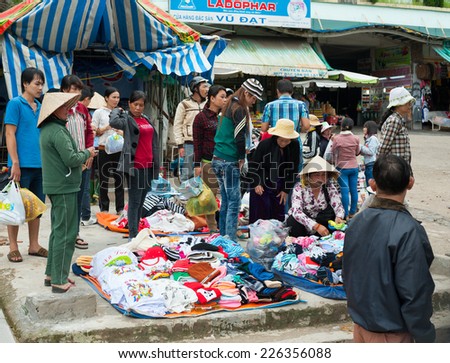 DALAT, VIETNAM - AUGUST 2, 2014: Unidentified people sell and buy warm clothes at the central city market. It is quite chilly in the evenings in Dalat.