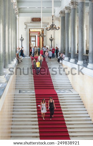 ST. PETERSBURG - JUNE 30, 2011: Unidentified tourists go down a staircase at the Hermitage. Over 3 million people visit the museum every year.