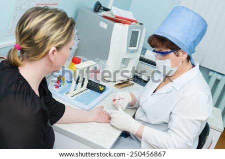 ULAN-UDE, RUSSIA - APRIL 6, 2010: An unidentified nurse makes blood test for volunteers before they donate blood.The City Blood Service makes a promo action for donorship popularization.