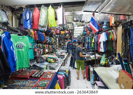 BANGKOK - MARCH 9, 2015: Unidentified people buy at a shop in Khao San Road Street. It is called the heart of backpackers universe.
