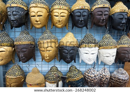 various Thai Buddhist masks as souvenirs for sale