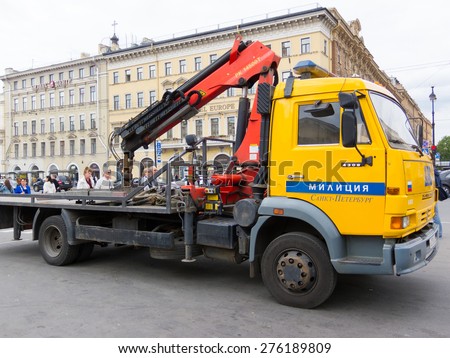 ST PETERSBURG - MAY 29, 2011: A wrecker bus of the city traffic police stands in Nevsky Prospekt in the downtown. Its task is to arrest cars breaking parking rules.