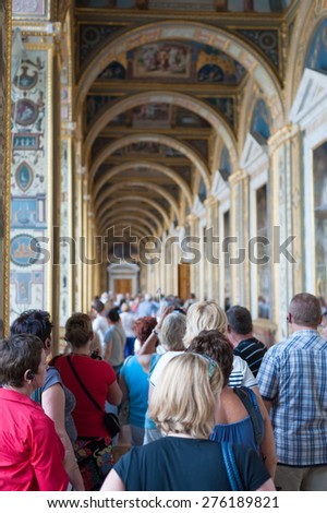 ST. PETERSBURG - JUNE 30, 2011: A group of unidentified tourists have a guided tour in the Hermitage, the biggest in Russia. To see all the displays one should walk 20 kilometers.