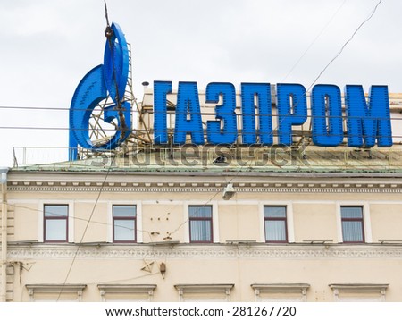 ST PETERSBURG - MAY 29, 2011: The logo of Gazprom at the roof in the downtown. It is the largest extractor of natural gas in the world and one of the worlds largest companies.