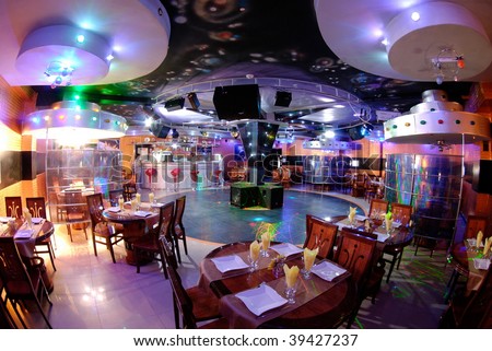 night club interior with bar and tables