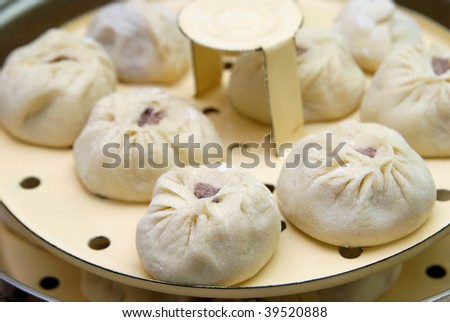 Buuza is one of Buryat (Mongolian) national dishes, paste packets stuffed with minced meat and then they are steamed. They are much similar to chinese dumplings.