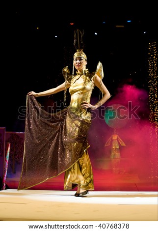 ULAN-UDE, RUSSIA - OCTOBER 29: An asian model demonstrates a dress in ethnic style at the international asian fashion festival on October, 29, 2009 in Ulan-Ude, Buryatia, Russia.