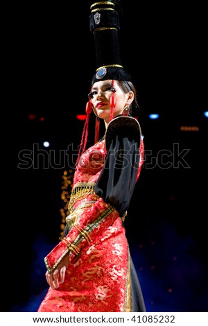 ULAN-UDE, RUSSIA - OCTOBER 29: An Asian model demonstrates a dress in ethnic style at the international Asian fashion festival on October, 29, 2009 in Ulan-Ude, Buryatia, Russia.