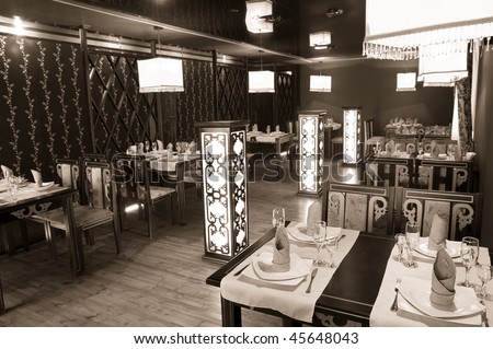 interior of a restaurant in oriental style with square lamps, sepia rendering