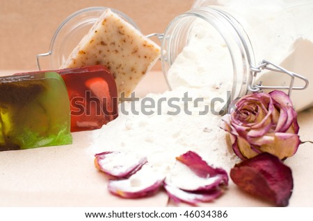 glass jar of powdered goat milk with natural components for bathing and handicraft soap, shallow DOF