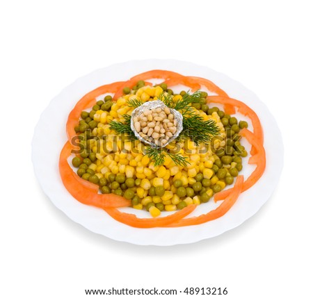 Canned corn with green peas and pine nuts, decorated with tomatoes and dill.