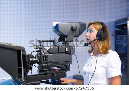 a female cameraman at a studio during live broadcasting