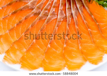sliced smoked salmon served with lemon slices