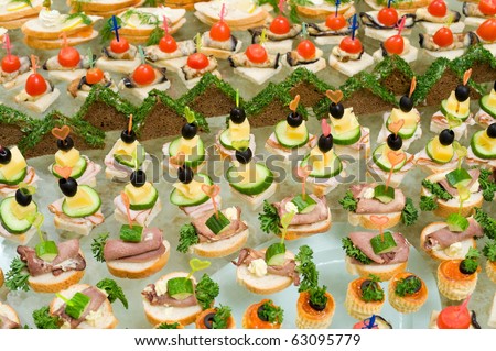 buffet table - a lot of canapes and sandwiches, shallow DOF