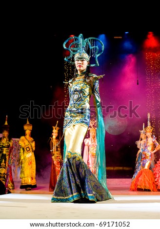 ULAN-UDE, RUSSIA - OCTOBER 29: An asian model wears an ethnic style dress at the International Asian Fashion Festival on October, 29, 2009 in Ulan-Ude, Buryatia, Russia.