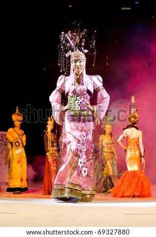 ULAN-UDE, RUSSIA - OCTOBER 29: An asian model demonstrates an original dress in ethnic style at the international asian fashion festival on October, 29, 2009 in Ulan-Ude, Buryatia, Russia.