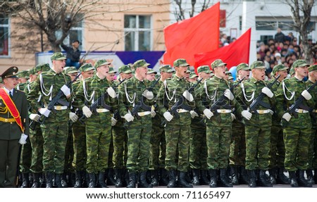 ULAN-UDE, RUSSIA - MAY 9: Young russian soldiers greet the commander at the parade on annual Victory Day, May, 9, 2010 in Ulan-Ude, Buryatia, Russia.