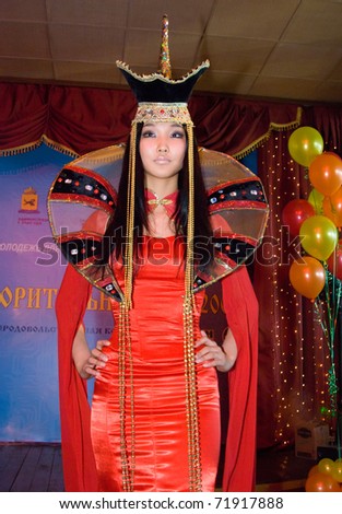 ULAN-UDE, RUSSIA - MARCH 25: A model wears a fancy dress in Mongolian ethnic style at the City Maecenas Ball on March, 25, 2009 in Ulan-Ude, Buryatia, Russia.