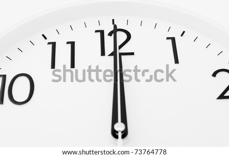 a white clock - twelve o\'clock (midnight or midday)