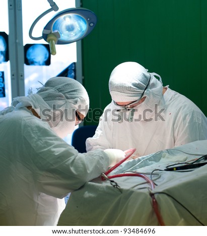 a real brain surgery, two surgeons at work