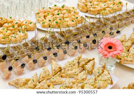 many cold snacks on buffet table, catering