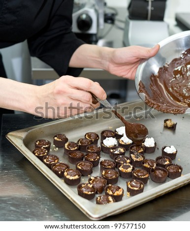 chef makes chocolate sweets according to his own recipe