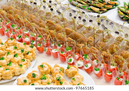 a lot of cold snacks on buffet table, catering